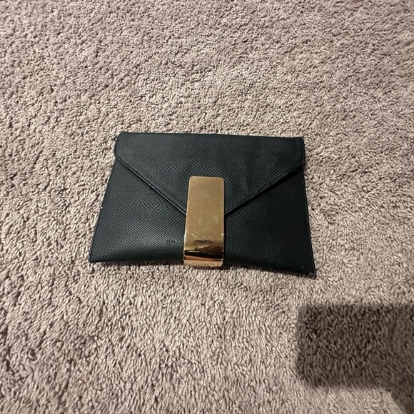Handbags - Black and Gold clutch.
